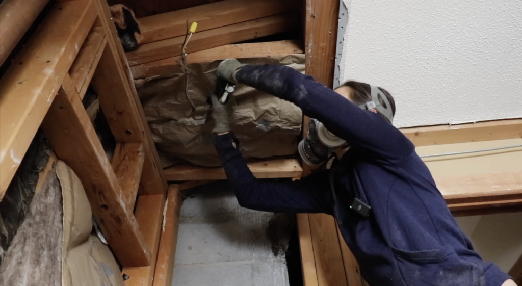 stapling the insulation to the studs 